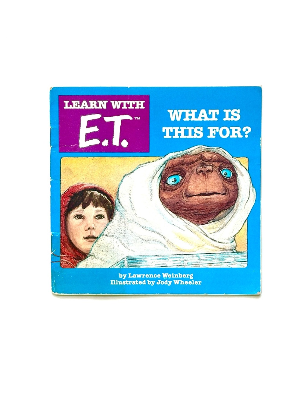 Vintage 1982 children's book titled Learn With E.T. What Is This For?